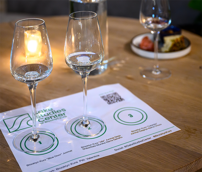 Sake tasting flight on a Sake Studies Center tasting mat